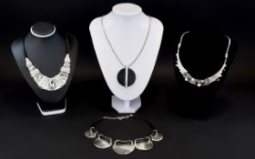 A Collection Of Contemporary Silver Tone Statement Necklaces Boxed collection stone and crystal set