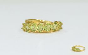 Peridot Seven Stone Band Ring, the oval cut peridots set diagonally,