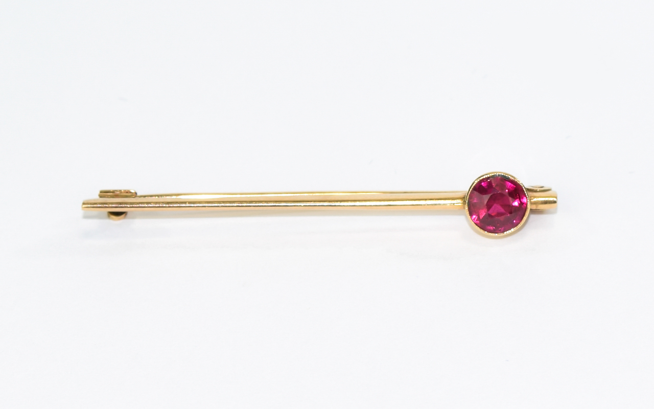 Antique Gold Brooch Set with Large Faceted Ruby. Not Marked but Tests Gold. 4.5 grams.