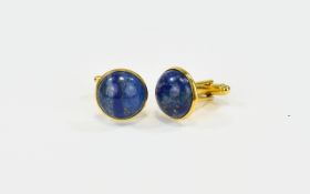 Lapiz Lazuli Cufflinks Circular cufflinks set with lapiz in gold tone metal.