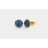 Lapiz Lazuli Cufflinks Circular cufflinks set with lapiz in gold tone metal.