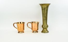Copper Tankards Two in total, debossed to outer, marked 'Pint' underside marked 'Oldham Maker
