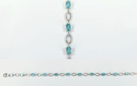 Paraibe Apatite Tennis Bracelet, oval cut solitaires of paraibe apatite,