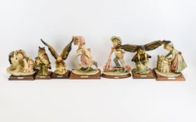 A Collection Of G Armani Resin Figures Seven in total,