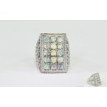 Opal Rectangular Cluster Ring, a rectangle of round cut opals, totalling 3cts,