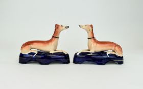 A Fine Pair of Hand Painted Staffordshire Whippets / Greyhounds Pen Holders Figures, Raised on