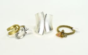 Statement Cuff And Bracelets Three in total to include large silver tone hinged statement cuff with
