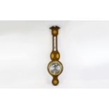 Barometer Wall mounted barometer housed in inlaid wood surround, silver tone dial, approx length 33.