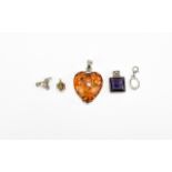A Large Heart Shaped Amber Set Pendant. Fully Hallmarked + Four Silver Set Small Pendants.