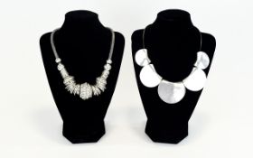 Silver Tone Statement Necklaces Two in total, one crystal set with multiple hoop and bead links.