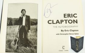 Eric Clapton Autograph in his book 'Clapton'.