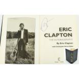 Eric Clapton Autograph in his book 'Clapton'.