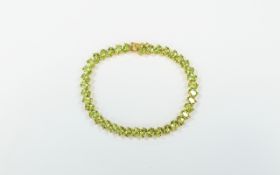 Peridot Tennis Bracelet, a single row of