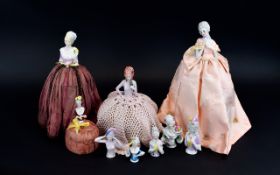 A Large Collection Of Ceramic Boudoir Half Dolls Ten in total, four as complete dolls/pin cushions,