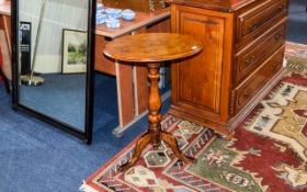 Mirror Oval mirror in dark gilt frame with central bow and floral moulding to top. Approx height 23.