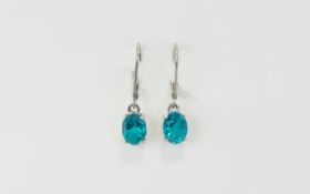 Ocean Teal Quartz Drop Earrings, each earring having a 1.5ct oval cut stone set in platinum