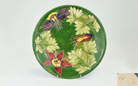 Walter Moorcroft - Signed Tube lined Early Cabinet Plate. Columbine Design on Green Ground. c.