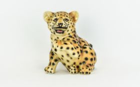 Ceramic Cheetah Cub Figure Playful Cheetah figure with open mouth and raised paw. Approx height,