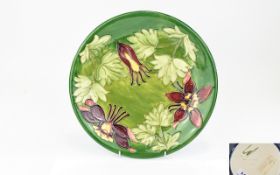 Walter Moorcroft - Signed Tube lined Early Cabinet Plate. Columbine Design on Green Ground. c.