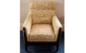 Arm Chair Dark wood upholstered arm chair with deep seat and plush back and arms. Finished in