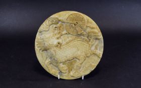 Chinese Hardstone Carved Roundel The Carved Front Depicting A Stylised Dragon, Diameter 9 Inches