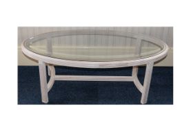 Contemporary Glass Coffee Table Oval form in pale stone coloured wood with stylised curved