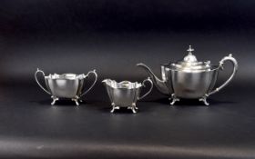 Plated Tea Service Late 19th century EPNS footed teapot, milk jug and sugar bowl.