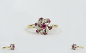 Ladies 18ct Gold Set Ruby and Diamond Cluster Ring, flowerhead setting. full hallmarked.