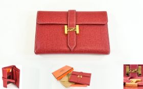 A Hermes Paris Red Ladies Purse Complete with cotton dustbag and original orange box.