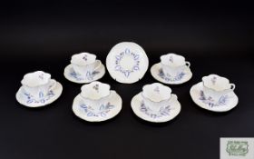 Shelley Floral Tea Cups And Saucers Seven Items in total in floral form with gilt trim. Set