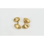 Antique Period Pair Of Gents Oval Shaped Cufflinks With chased decoration in 15ct gold.