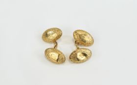 Antique Period Pair Of Gents Oval Shaped Cufflinks With chased decoration in 15ct gold.