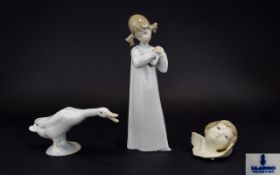 A Collection Of Lladro Figures Three in total to include Young girl playing guitar,