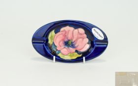 Moorcroft Tube lined Oval Shaped Ash Tray with Original Label ' Coral Hibiscus ' Design on Royal