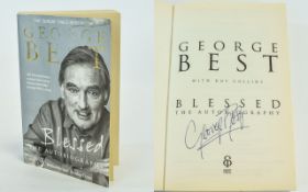 George Best Autograph in his book 'Blessed'.