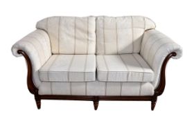 Two Seater Sofa Elegant two seater sofa with curved arms and carved scroll detail to arms and