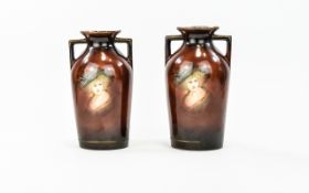 A Pair Of Late 19th Century European Twin Handle Vases Two small vases of plain form,