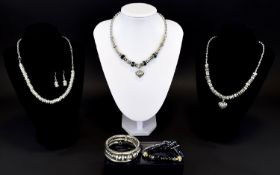 A Collection Of Bead Crystal And Silver Tone Costume Jewellery Housed in original gift box,