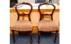 A Pair Of Bedroom Chairs Two balloon backed chairs with floral carved detail to headrest,