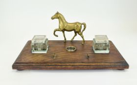 A Vintage and Large Gentleman's Desk Oak Based Double Inkstand with a Figural Brass Horse Figure,