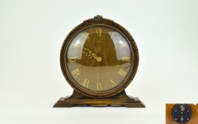 Smiths 1930's Circular Carved Oak Mantle Clock. 9.5 Inches High & 9.5 Inches Wide. In Working Order.