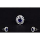 Ladies 18ct White Gold Diamond Cluster Ring Set With A Central Blue Sapphire Surrounded By Eleven