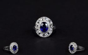 Ladies 18ct White Gold Diamond Cluster Ring Set With A Central Blue Sapphire Surrounded By Eleven