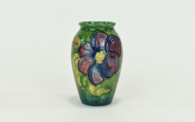 Moorcroft Small Tube lined Floral Vase ' Clematis ' Design on Green Ground.
