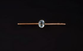 Victorian Period 9ct Gold Bar Brooch Set to Centre with an Oval Shaped Aquamarine of Good Colour.