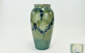 - William Moorcroft Signed Large Tube lined Vase ' Blueberries and Leaves ' Design. Date.