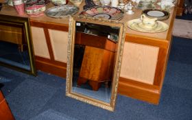 Bevelled Glass Mirror Large rectangular mirror in ornate distressed gilt frame.