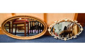 Oval Over Mantle Mirror Large bevelled glass mirror with ornate dark gilt frame.