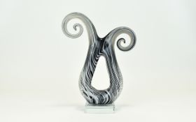 A Murano Style Striated Scroll Form Glass Object.
