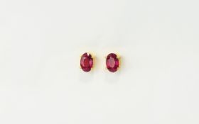 Ruby Solitaire Stud Earrings, single oval cut rubies totalling 1.2cts set in 14ct gold vermeil and